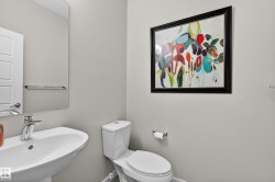 Half bathroom with a sink and toilet - 