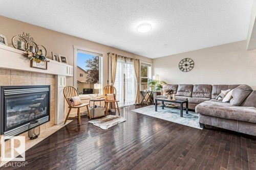 1137 37B Avenue, Edmonton, AB - Indoor Photo Showing Living Room With Fireplace