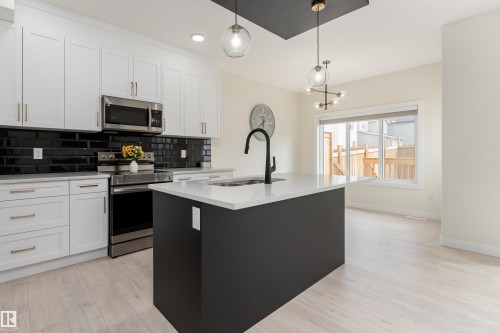 112 Bluff Cove, Leduc, AB - Indoor Photo Showing Kitchen With Upgraded Kitchen