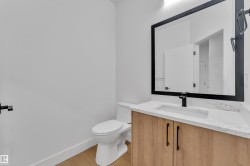 Bathroom featuring vanity and light wood-style floors - 