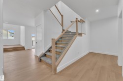 Stairs featuring wood finished floors and recessed lighting - 
