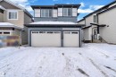 View of front facade with a garage - 733 Astoria Way, Devon, AB  - Outdoor 