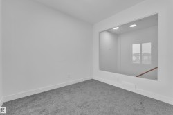 Carpeted empty room with baseboards - 