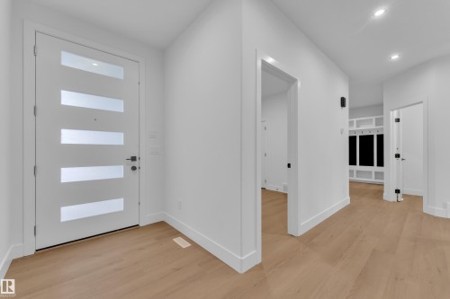 Entryway with light wood-style floors and recessed lighting - 733 Astoria Way, Devon, AB - Indoor Photo Showing Other Room