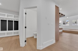 Bathroom with recessed lighting and light wood finished floors - 