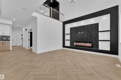 Unfurnished living room with a fireplace, parquet floors, recessed lighting, and a high ceiling - 