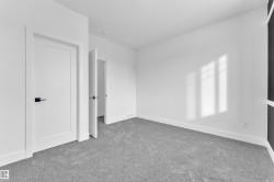 Unfurnished bedroom with carpet and baseboards - 