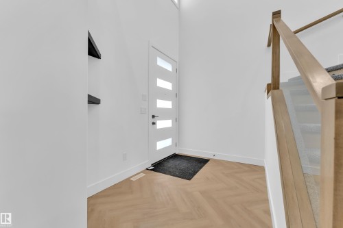 Foyer entrance featuring stairs and parquet flooring - 737 Astoria Way, Devon, AB - Indoor Photo Showing Other Room