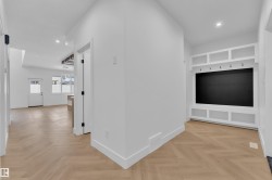 Corridor featuring parquet floors and recessed lighting - 
