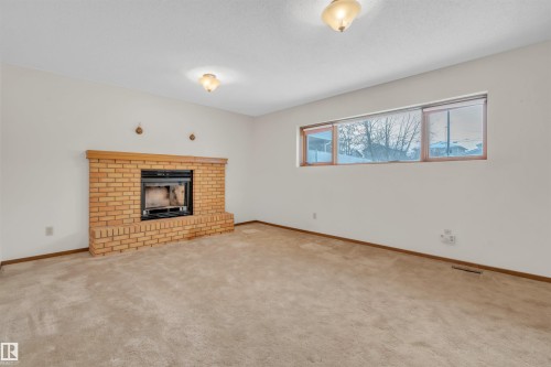 513 16 Street, Cold Lake, AB - Indoor Photo Showing Living Room With Fireplace