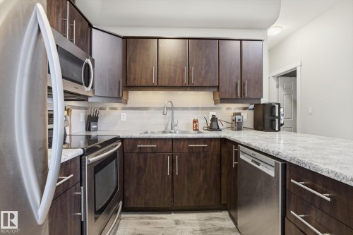 618 10235 112 Street, Edmonton, AB - Indoor Photo Showing Kitchen With Double Sink With Upgraded Kitchen