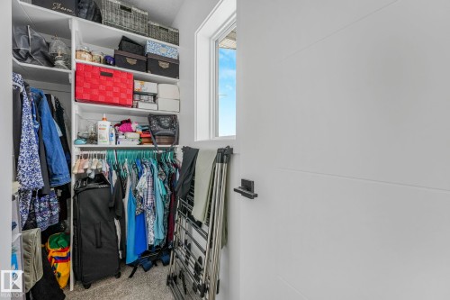 Walk in closet featuring carpet floors - 21 Sienna Boulevard, Fort Saskatchewan, AB - Indoor With Storage