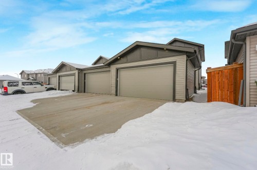 View of front of house featuring board and batten siding - 21 Sienna Boulevard, Fort Saskatchewan, AB - Outdoor With Exterior