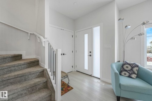Entrance foyer with stairway and light wood finished floors - 21 Sienna Boulevard, Fort Saskatchewan, AB - Indoor Photo Showing Other Room