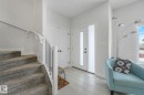 Entrance foyer with stairway and light wood finished floors - 21 Sienna Boulevard, Fort Saskatchewan, AB  - Indoor Photo Showing Other Room 