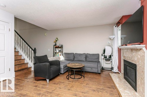 3 20 Deerbourne Drive, St. Albert, AB - Indoor Photo Showing Living Room With Fireplace