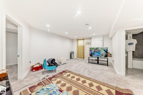 Sitting room featuring carpet floors and recessed lighting - 5814 165 Avenue, Edmonton, AB - Indoor