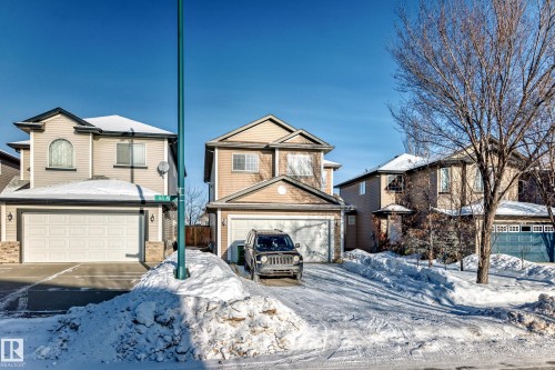 View of front facade with an attached garage - 5814 165 Avenue, Edmonton, AB - Outdoor With Facade