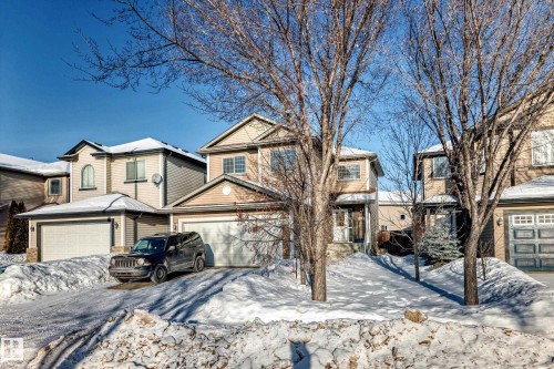 View of front of home featuring a garage and driveway - 5814 165 Avenue, Edmonton, AB - Outdoor