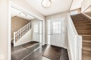 Entryway featuring stairway and dark tile patterned flooring - 5814 165 Avenue, Edmonton, AB  - Indoor Photo Showing Other Room 