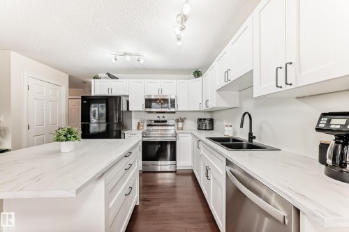 106 Rue Monique, Beaumont, AB - Indoor Photo Showing Kitchen With Double Sink With Upgraded Kitchen