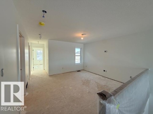 View of unfurnished living room - 16512 34 Avenue, Edmonton, AB - Indoor Photo Showing Other Room