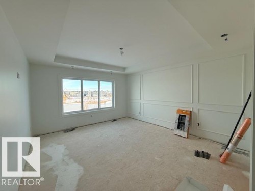 Spare room featuring a decorative wall - 16512 34 Avenue, Edmonton, AB - Indoor Photo Showing Other Room