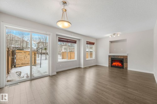 6 14208 36 Street, Edmonton, AB - Indoor Photo Showing Living Room With Fireplace
