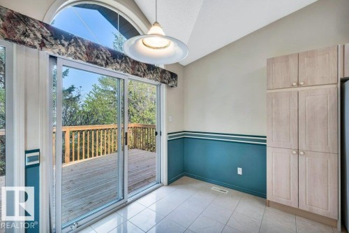 Unfurnished dining area with lofted ceiling and light tile patterned flooring - 112 Haddow Close, Edmonton, AB -  Photo Showing Other Room
