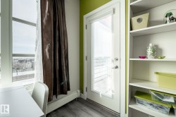Entryway featuring a baseboard heating unit and wood finished floors - 