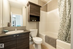 Bathroom featuring vanity and shower / tub combo with curtain - 