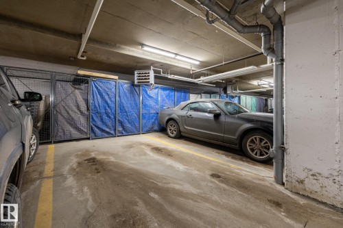 Parking garage featuring a heating unit - 407 2590 Anderson Way, Edmonton, AB - Indoor Photo Showing Garage