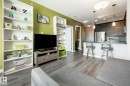 Living area with light wood-style floors and baseboards - 407 2590 Anderson Way, Edmonton, AB  - Indoor 