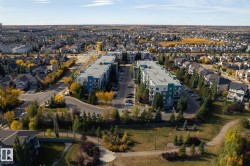 Aerial view of property and surrounding area with nearby suburban area - 