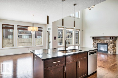4450 Crabapple Landing, Edmonton, AB - Indoor Photo Showing Kitchen With Fireplace With Double Sink With Upgraded Kitchen