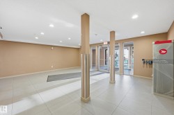 Below grade area featuring recessed lighting and light tile patterned flooring - 