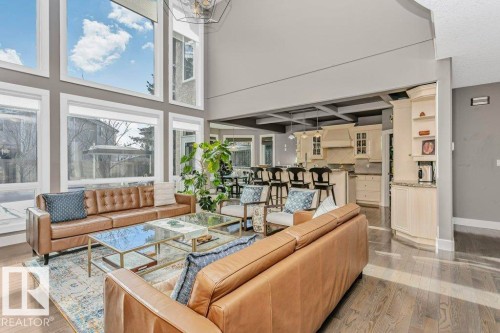 Living room with a high ceiling and light wood-type flooring - 1579 Hector Road, Edmonton, AB - Indoor Photo Showing Living Room