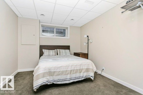Bedroom with a paneled ceiling and carpet - 1579 Hector Road, Edmonton, AB - Indoor Photo Showing Bedroom