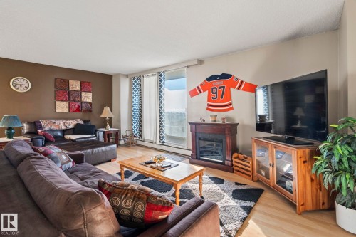 802 10883 Saskatchewan Drive, Edmonton, AB - Indoor Photo Showing Living Room With Fireplace