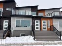 Snow covered property with brick siding and a balcony - 2750 Blatchford Road, Edmonton, AB  - Outdoor With Balcony With Facade 