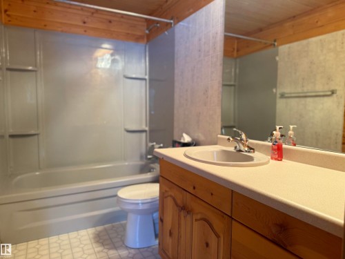 Bathroom featuring vanity, shower / tub combination, and wood ceiling - 34 Ella Mae Crescent, Rural Athabasca County, AB - Indoor Photo Showing Bathroom