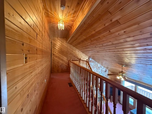 Hallway featuring wood ceiling and wooden walls - 34 Ella Mae Crescent, Rural Athabasca County, AB - Indoor Photo Showing Other Room