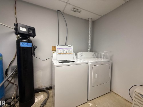 Laundry room with unfinished concrete flooring and washer and clothes dryer - 34 Ella Mae Crescent, Rural Athabasca County, AB - Indoor Photo Showing Laundry Room