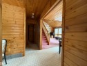 Hallway with wooden ceiling, wood walls, stairs, and tile patterned floors - 34 Ella Mae Crescent, Rural Athabasca County, AB  - Indoor Photo Showing Other Room 