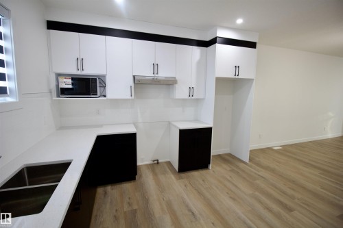 261 Munn Way, Leduc, AB - Indoor Photo Showing Kitchen With Double Sink