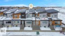 Snow covered back of property featuring solar panels - 2744 Blatchford Road, Edmonton, AB  - Outdoor With Facade 