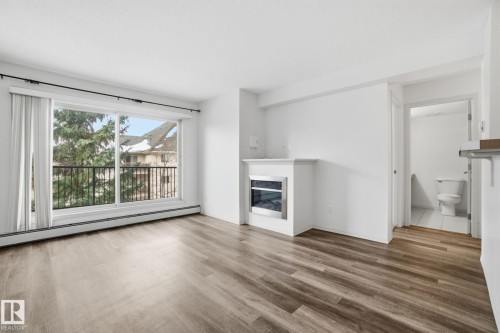 424 17011 67 Avenue, Edmonton, AB - Indoor Photo Showing Living Room With Fireplace