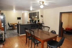 Dining room featuring light wood-type flooring and a ceiling fan - 