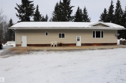 View of snow covered rear of property - 