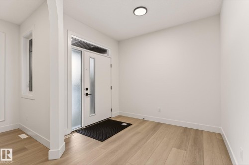 Entryway with baseboards and light wood finished floors - 9 Elwyck Gate, Spruce Grove, AB - Indoor Photo Showing Other Room